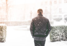 Man Walking in Snowfall Photo by Viktor Hanacek