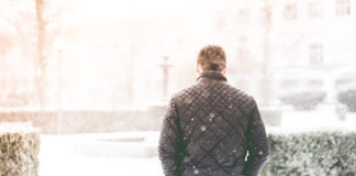 Man Walking in Snowfall Photo by Viktor Hanacek