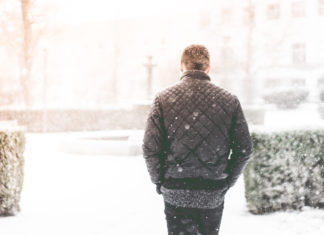 Man Walking in Snowfall Photo by Viktor Hanacek