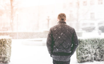 Man Walking in Snowfall Photo by Viktor Hanacek